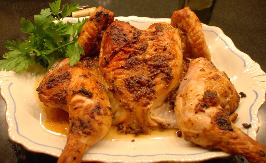 Buttermilk roast chicken on a white platter.