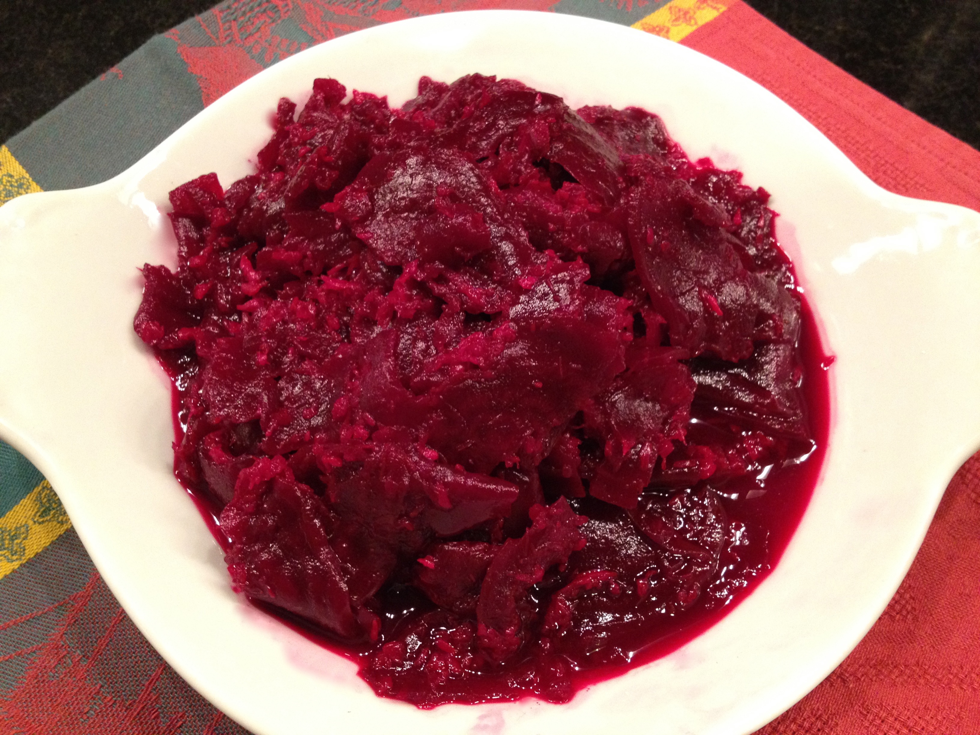 Beets and horseradish on a white plate. Chrzan on a white plate.