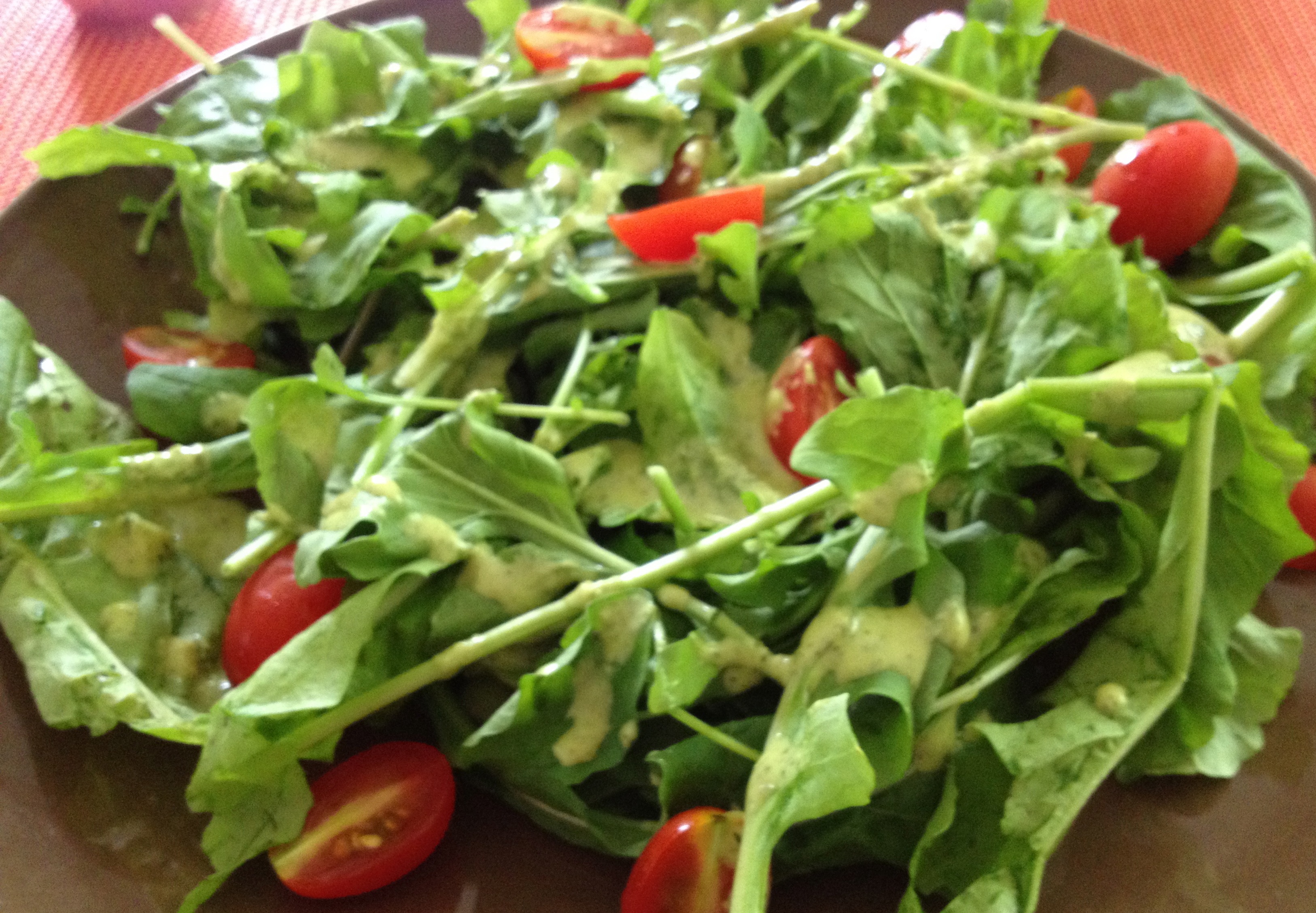 Lemon Anchovy dressing on salad with tomatoes. 