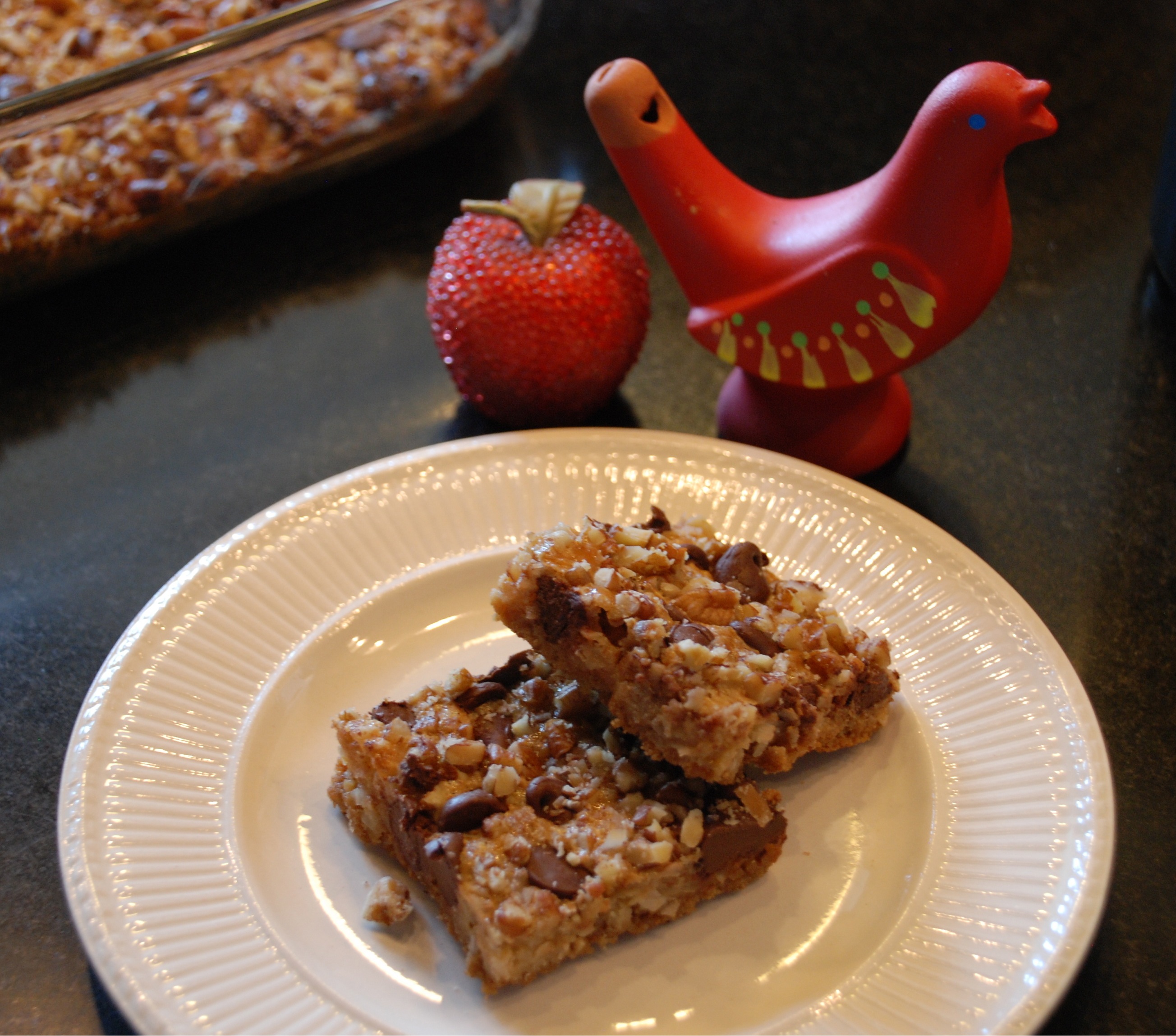 christmas cookies that are Hello Dolly squares with coconut, chocolate and pecans