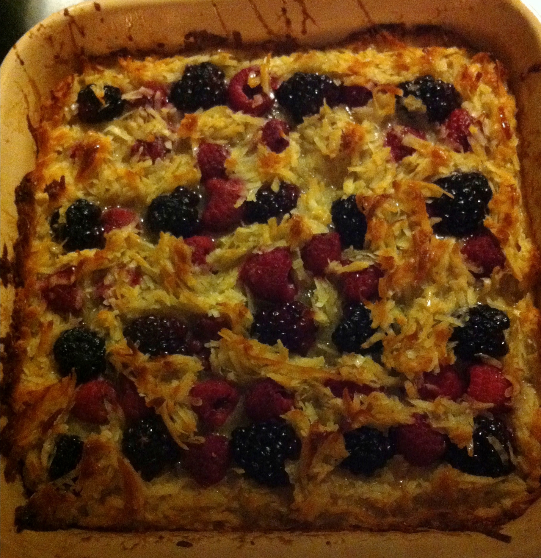 Coconut, raspberry, blackberry tarte in a Le Creuset pan.