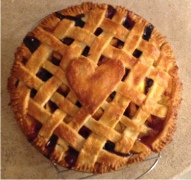 Peaches and blueberry lattice topped pie with a buttery crust.