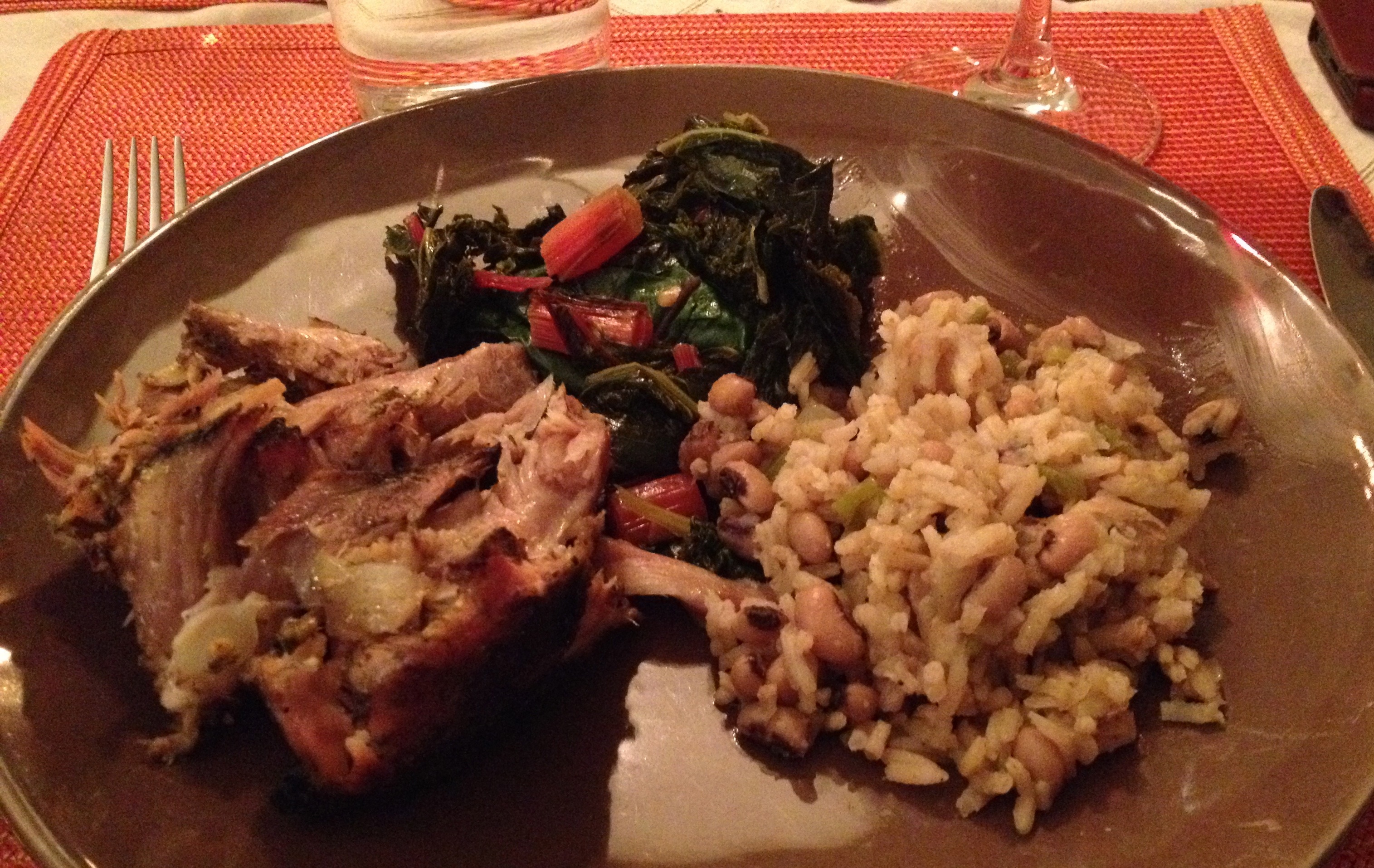 Dinner plate with peril, sautéed kale and Swiss chard with Jasmine rice and black eyed peas.