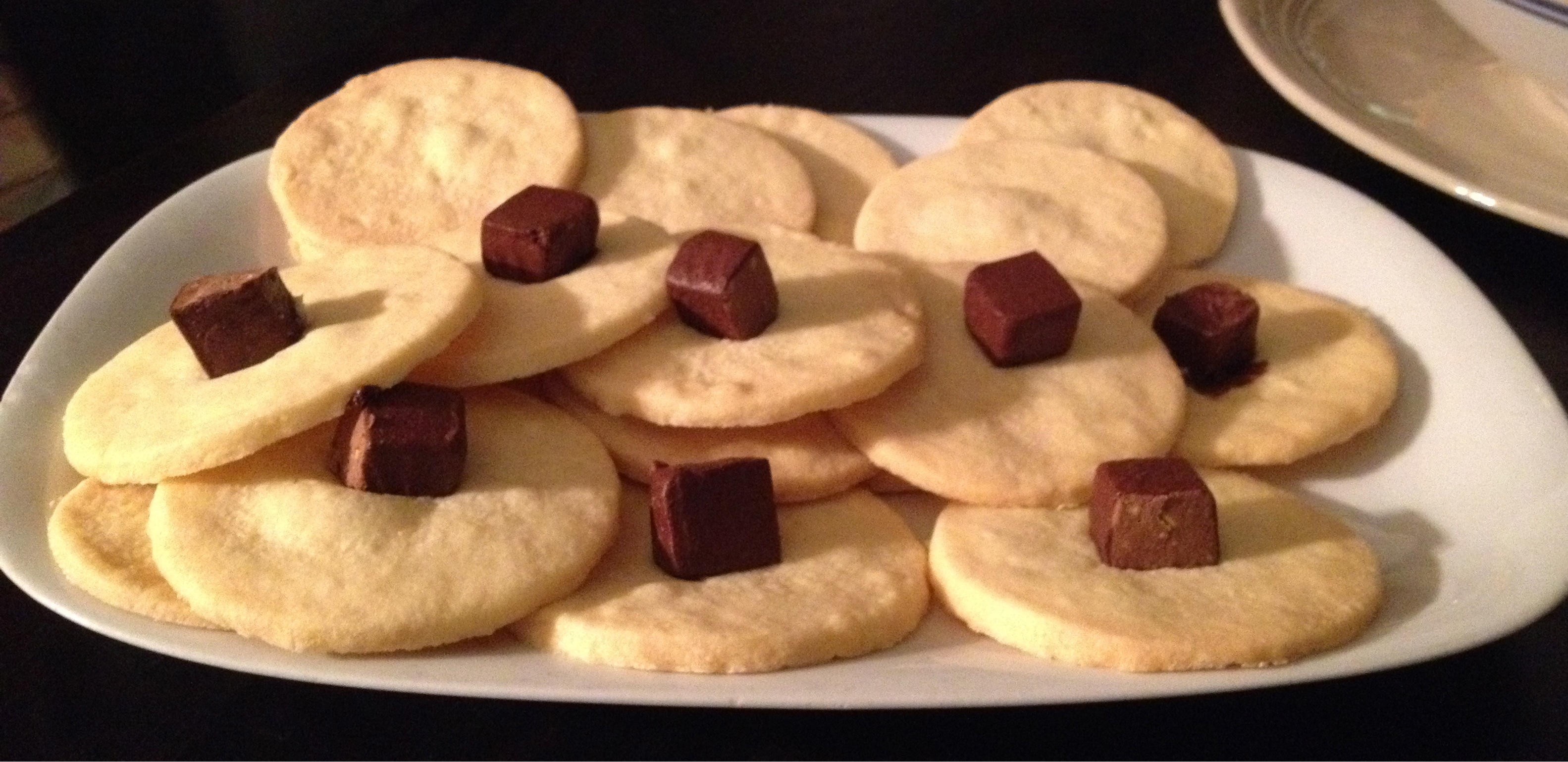 Homemade shortbread cookies topped with Polish hazelnut chocolate chunks.
