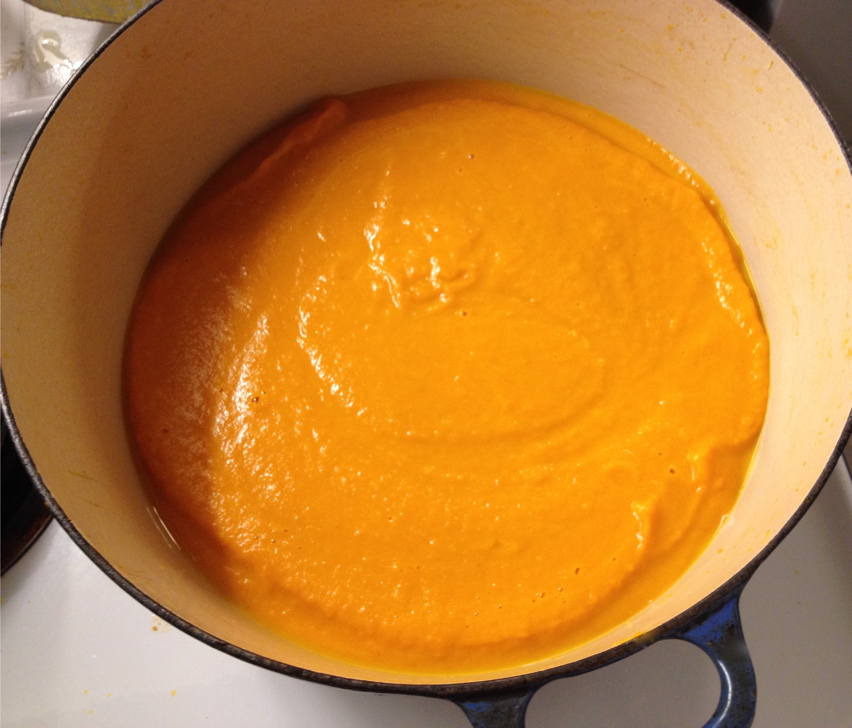 Carrot ginger soup finished in a Le Creuset pot.