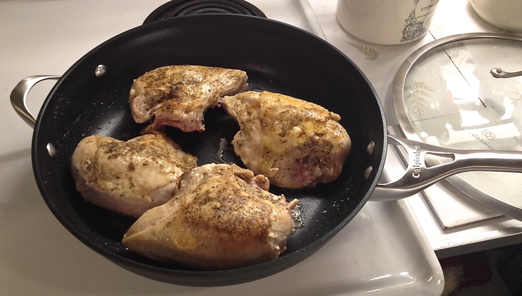 Calphalon skillet browning chicken breasts.