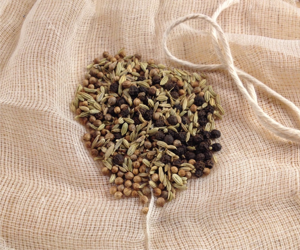 Fennel, coriander and peppercorns on cheesecloth ready to be bundled and tied.