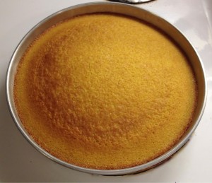 Olive oil cake cooling in a pan.
