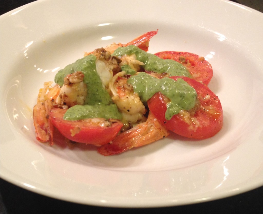 Smoulder on shrimp and tomatoes topped with sorrel sauce.