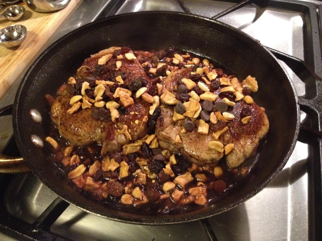Chili Chocolate Pork Chops with Apple Aplenty in a skillet.