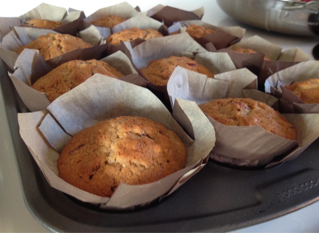 Cranberry walnut muffins baked in a baking tray.