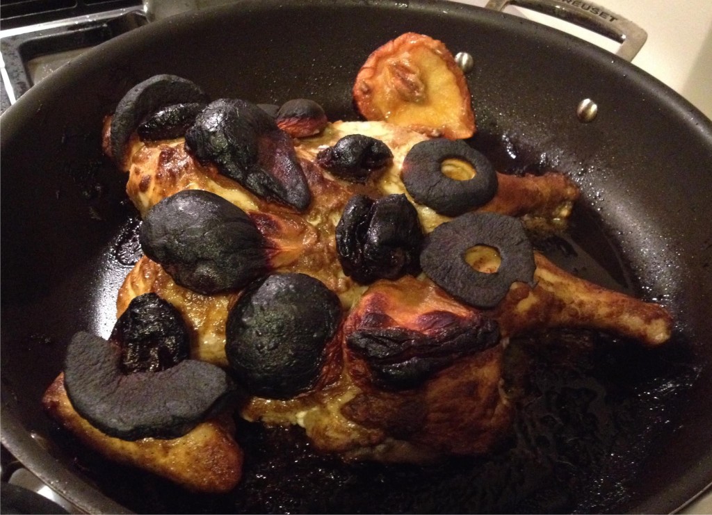 Mustard and cumin chicken with charred dried fruit on top.