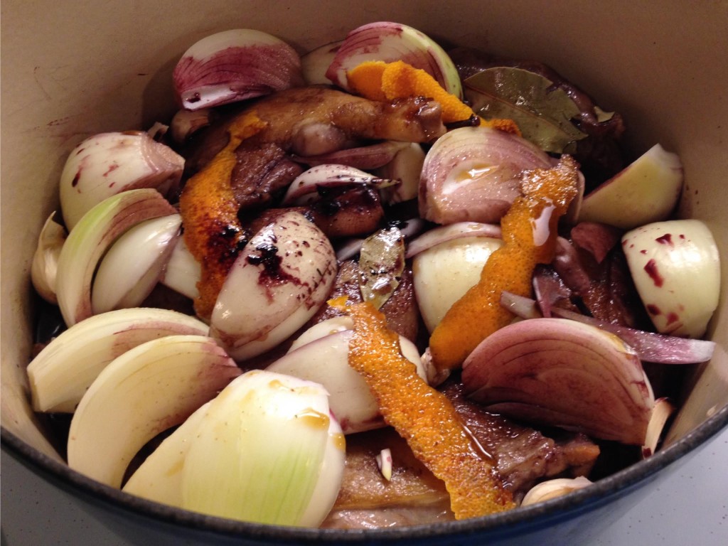 Duck braised with Red wine and Prunes ready for the oven in a Le Creuset pot.