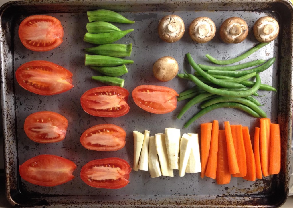 Vegetables lined up to roast in the oven.