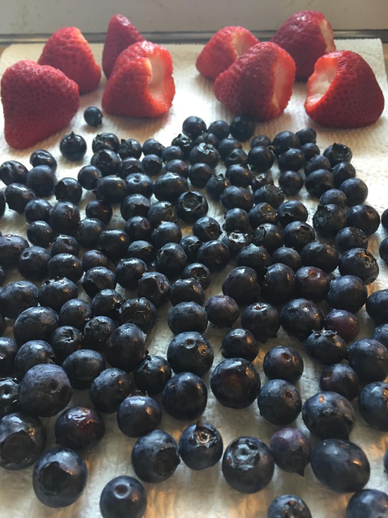 Strawberries and blueberries air drying.