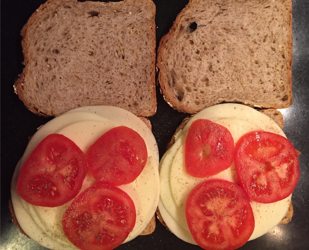 Making grilled Provolone cheese and tomato sandwiches.