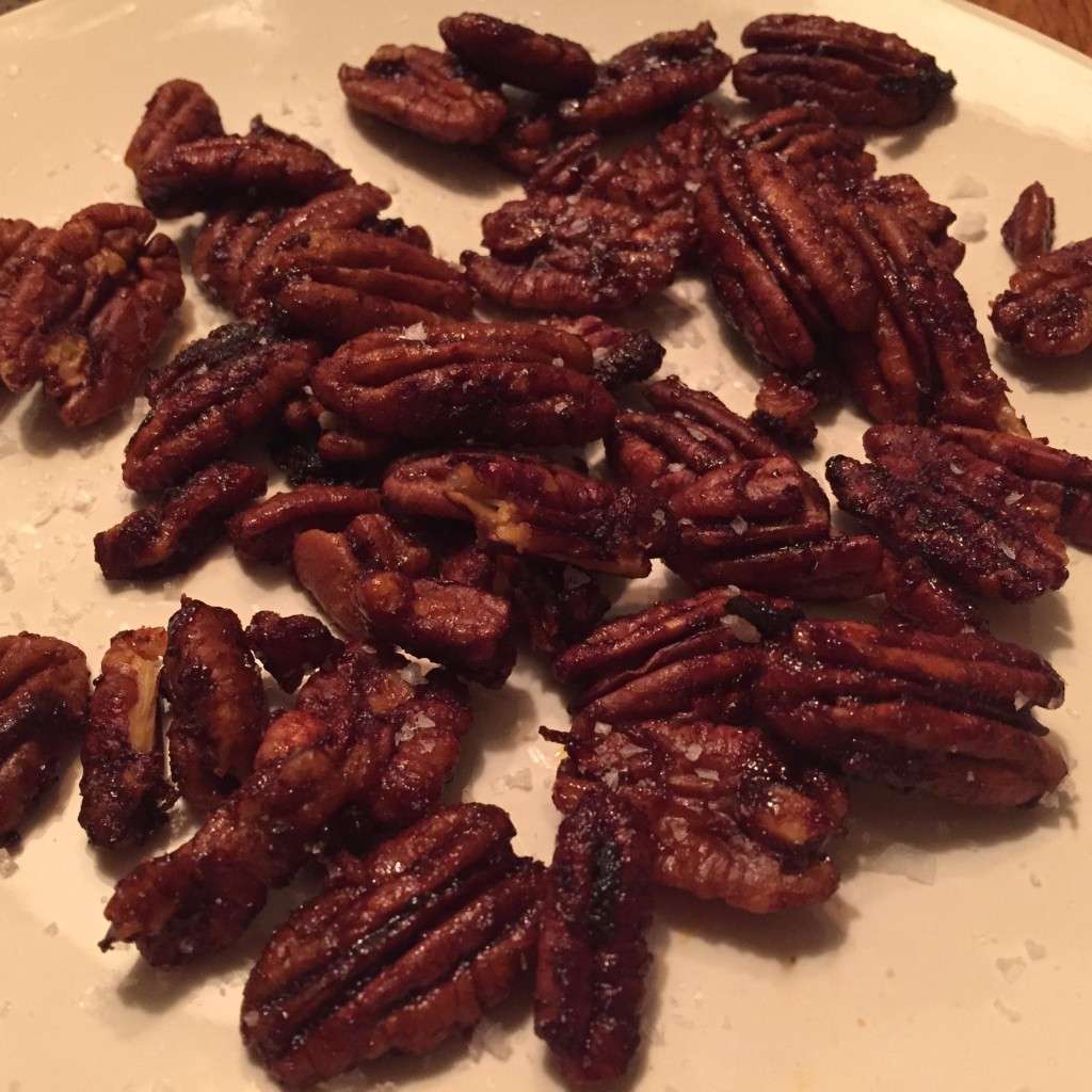 Rufus Teague Roasted Pecans on a cream colored plate.