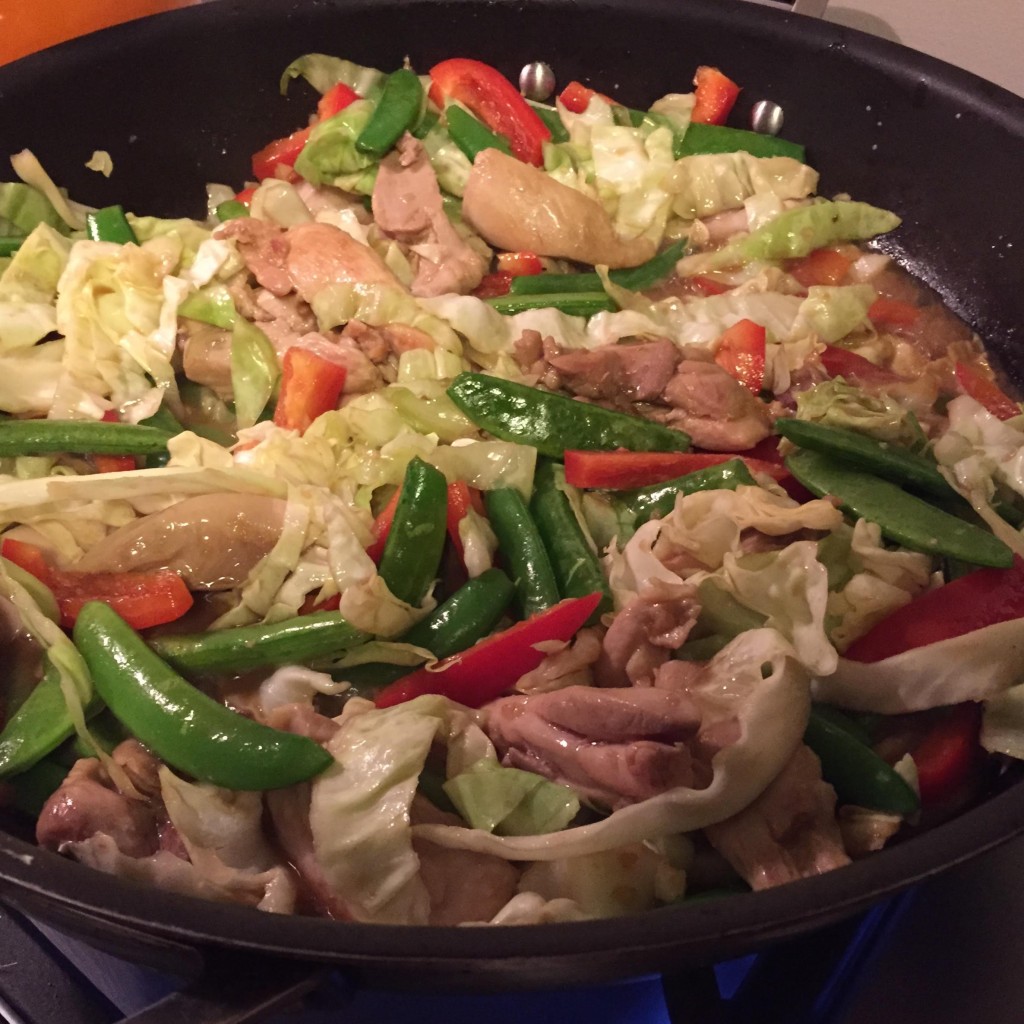 Super quick chicken and summer vegetable stir-fry in a skillet.