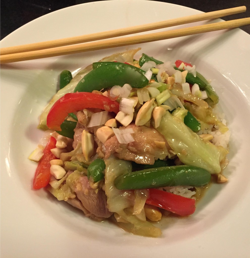 Super quick chicken and summer vegetables stir-fry in a white bowl with chopsticks.