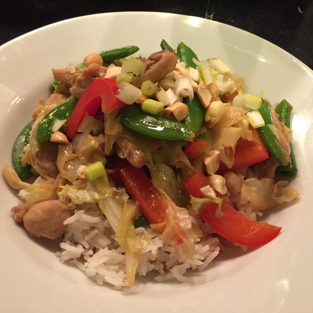 Super quick chicken and summer vegetable stir-fry  in a white bowl.