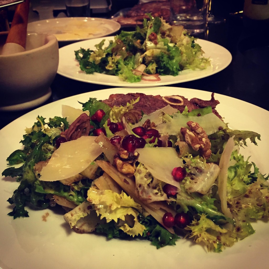 Chicory salad with pomegranate seeds.