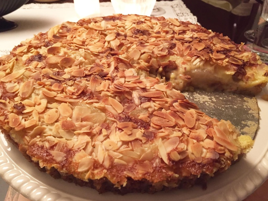 Honeyed Pear Clafouti Tart topped with sliced almonds.