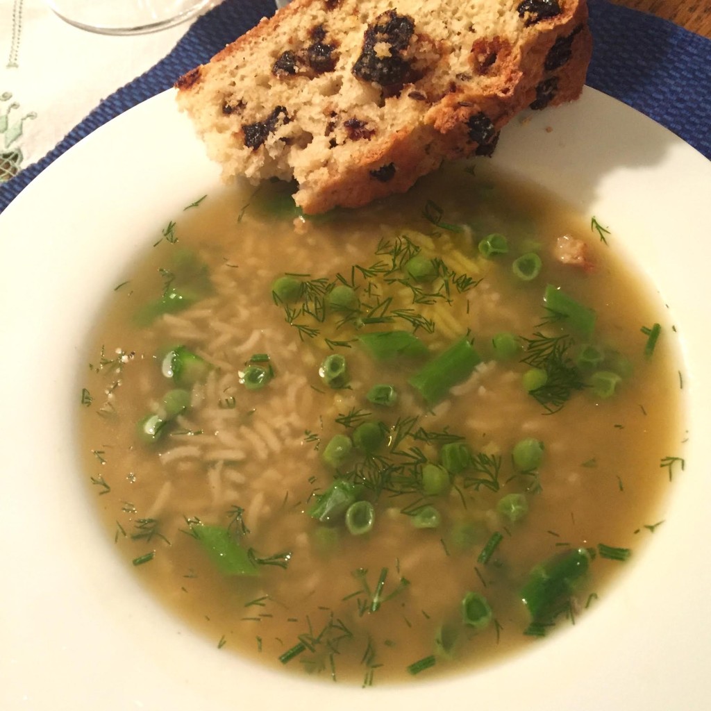 Spring chicken soup with asparagus, peas, rice and dill.