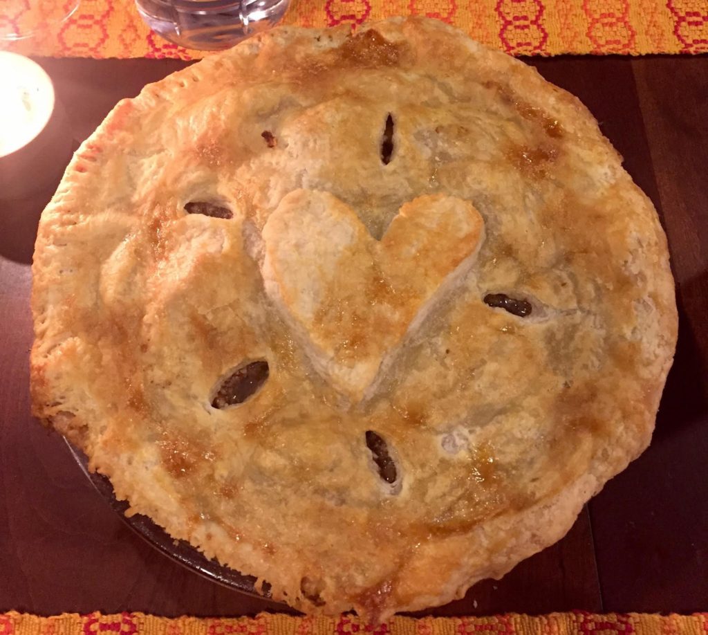 Pear pie with a heart on top.