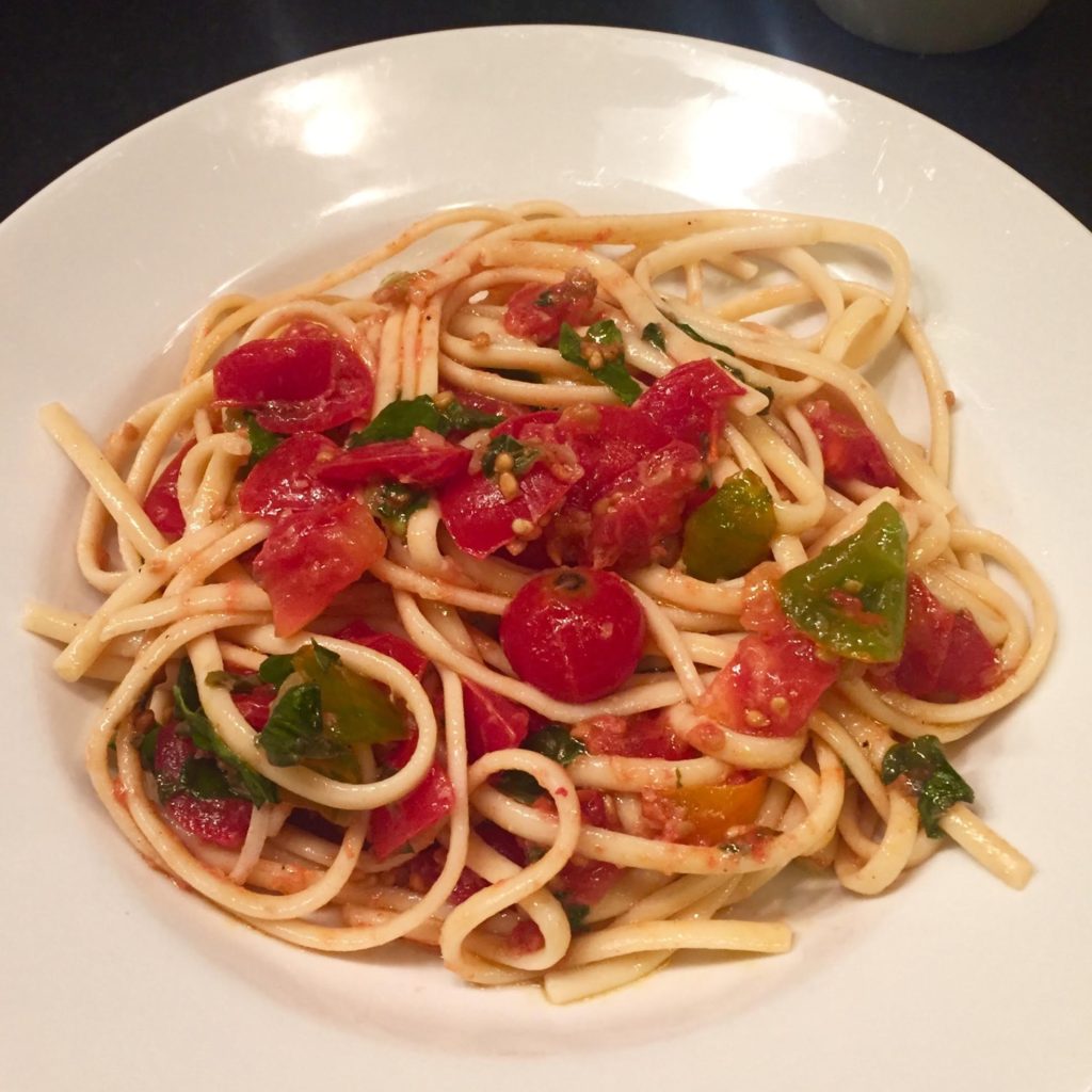 Super quick and easy Pasta with Fresh Tomato Sauce in a white bowl.