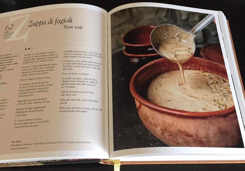 Tuscan cookbook open to bean soup recipe.