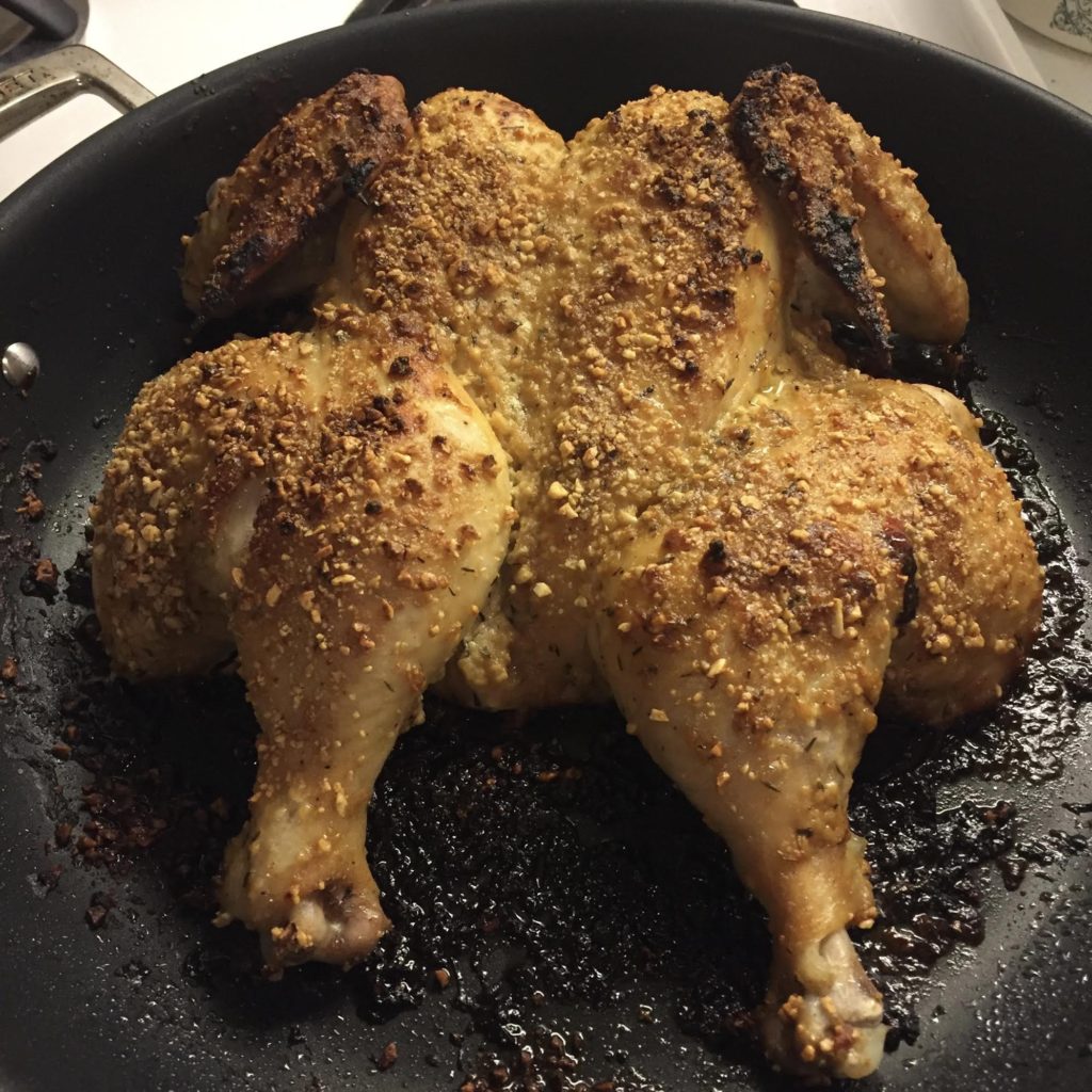 Quick Nuts Over Fish mustard roasted chicken finished chicken in a skillet.