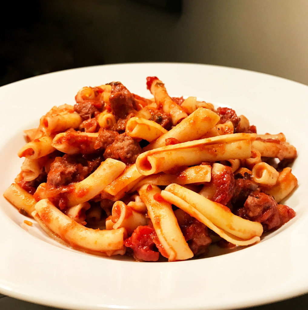 Quick Pasta with Sweet Sausage Bolognese in a white bowl.