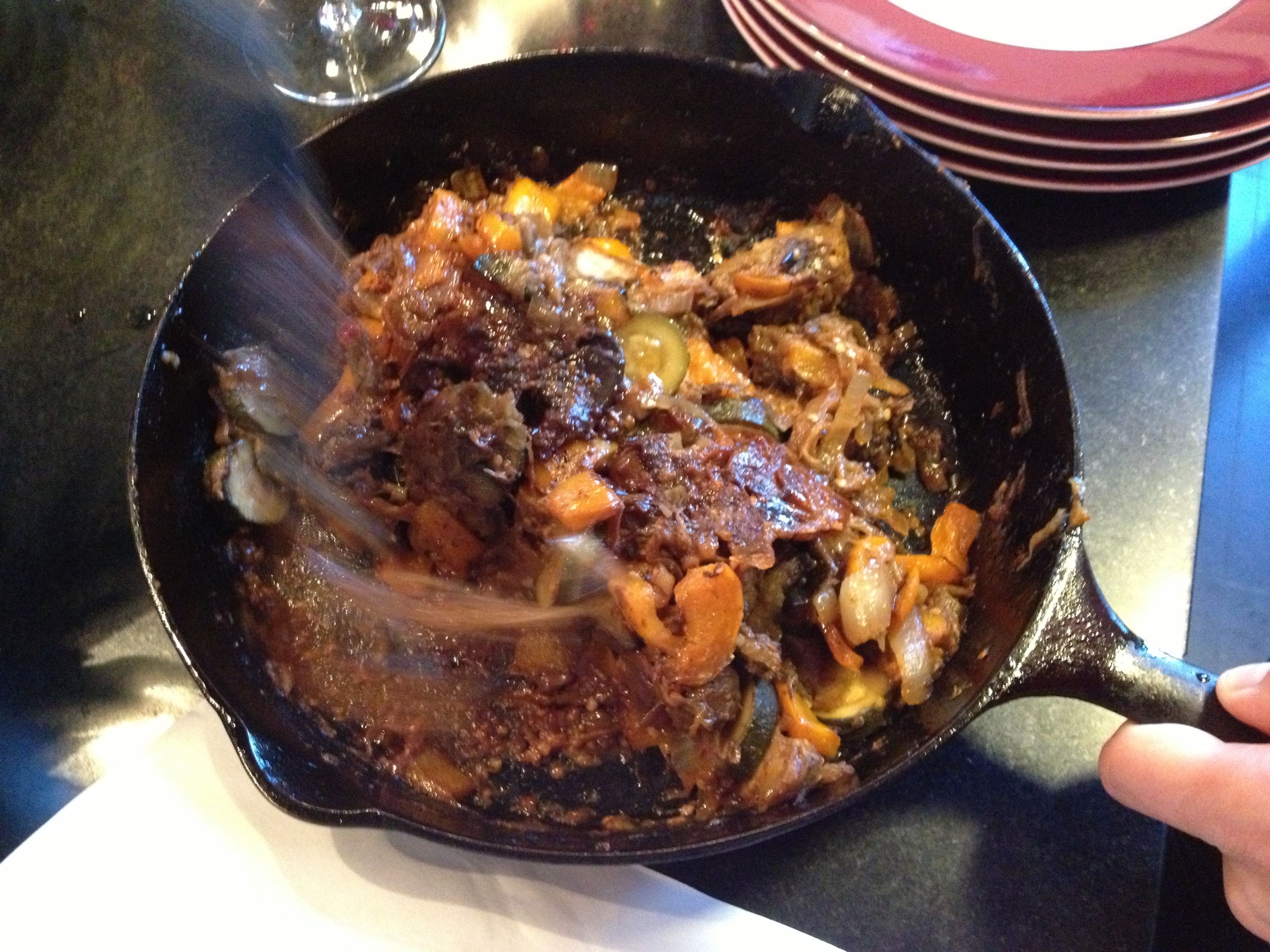 Skillet ratatouille being made in a black cast iron skillet, recipe from Food and Wine.